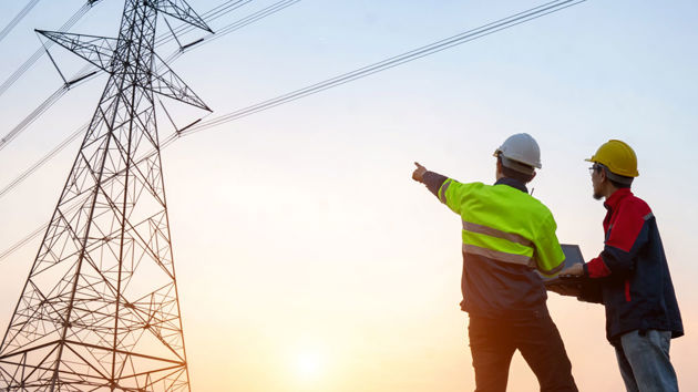 Two Engineers Reviewing Powerlines 