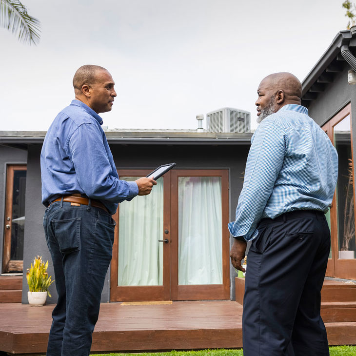 Home Inspector With Homeowner 