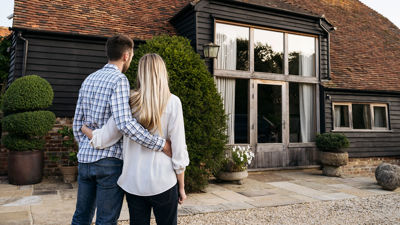 Couple Viewing Home Exterior 