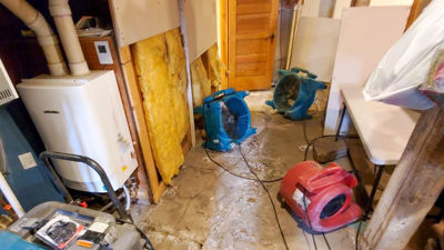 Fans Drying Residential Basement After Flood 