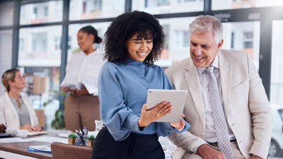 Colleagues Reviewing Tablet 