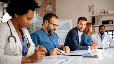 Medical Staff Reviewing Documents 