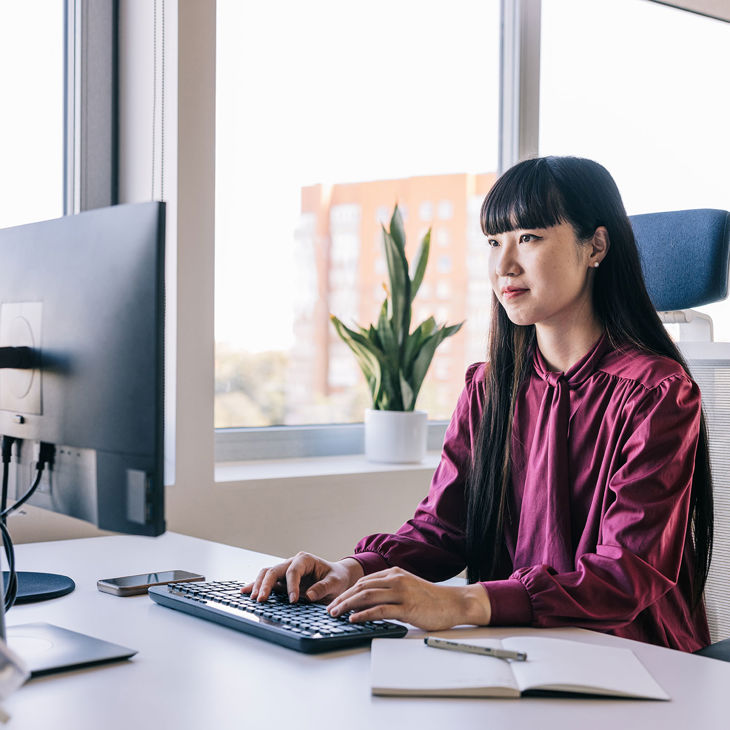 Person Working At Desktop Computer 