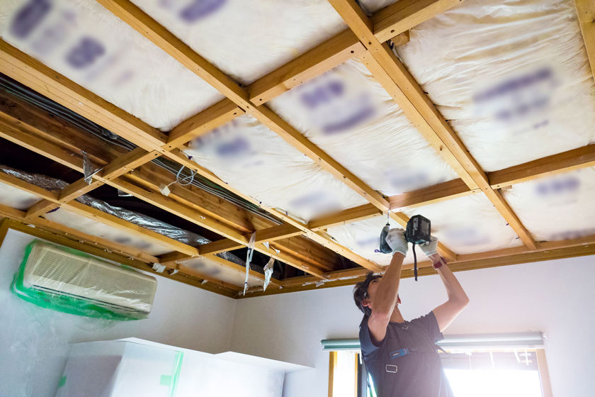 Contractor Working On Ceiling 