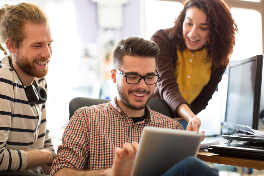 Colleagues Collaborating With Tablet 