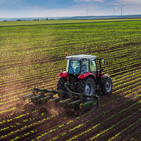 Farmland Horizon With Harvester 