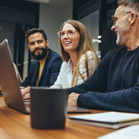 Colleagues Collaborating In Conference Room 
