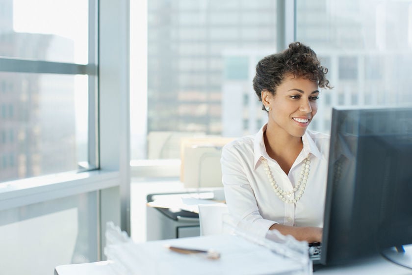 Pleased Worker Using Desktop Computer 
