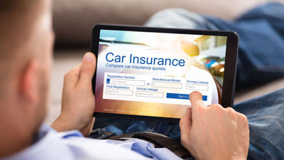 Comparing Auto Insurance Quotes On Tablet 
