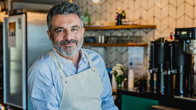 Cafe Owner Behind Counter 