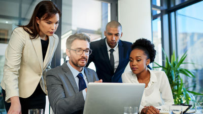 Colleagues Focused On Laptop Screen 