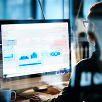 Man Reviewing Data On Computer 