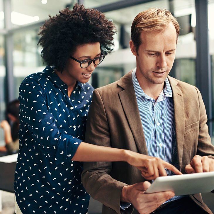 Colleagues Focused On Laptop 