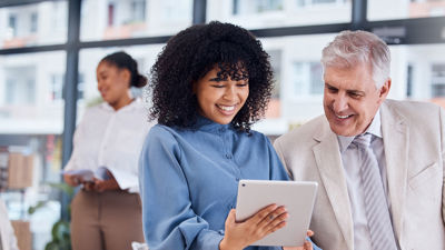 Colleagues Looking At A Tablet 