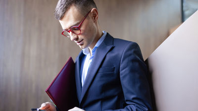 Person Looking Down At Phone 