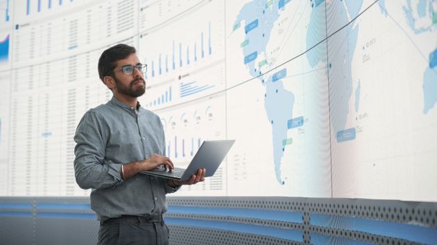 Standing Man Presenting Data 