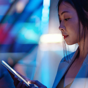 Woman Looking At Mobile Device 