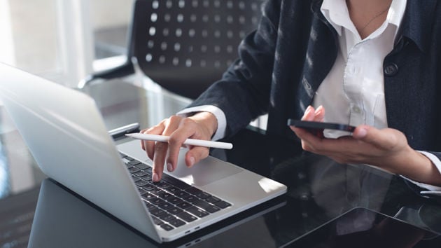 Businesswoman Working At Desk 