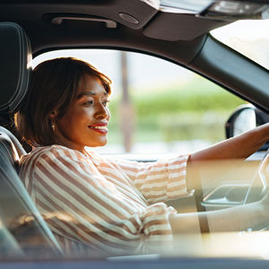 Smilingwomandrivingcar
