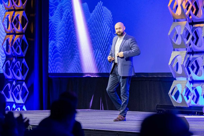 Man Presenting On Stage At Confrence 