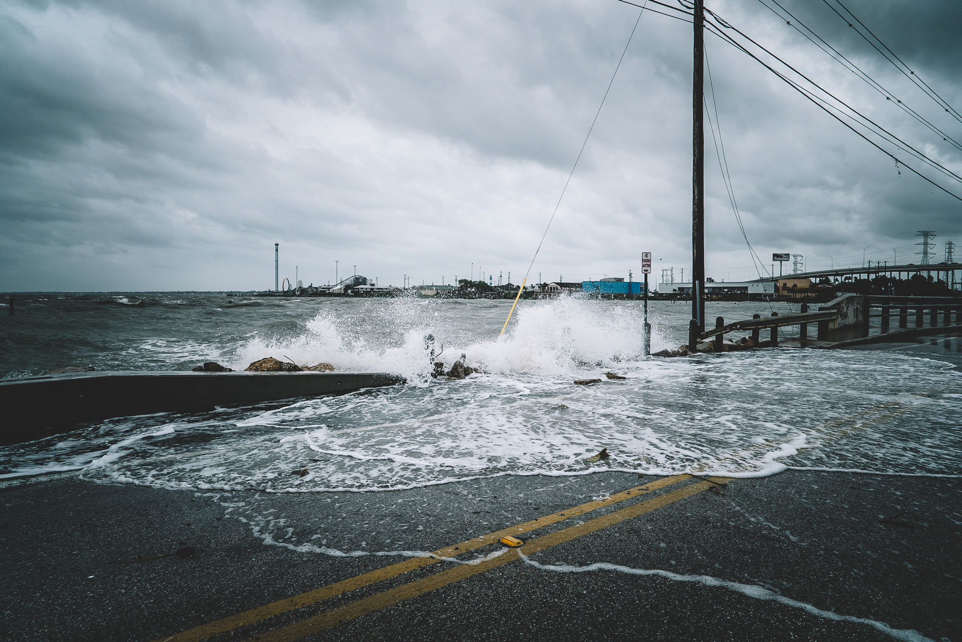 water-crashing-over-bridge-during-hurricane