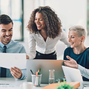 Pleased Colleagues Reviewing A Document 