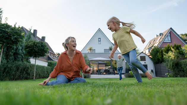 Happy Family Playing In Backyard 