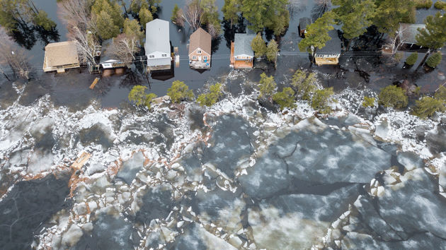 Freezing Floodwaters Encroaching On Houses 