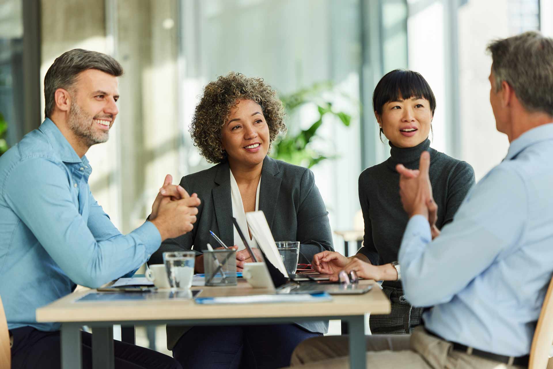 colleagues-chatting-around-table