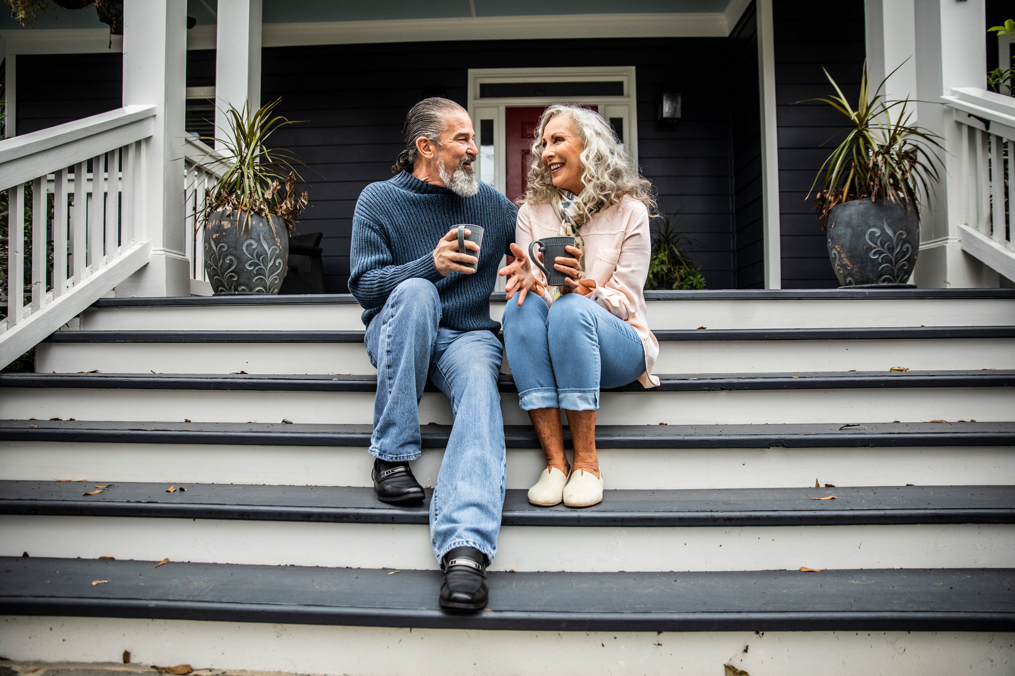 Couple On Porch Sipping Coffee 