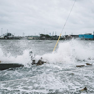 Water Crashing Over Bridge During Hurricane 