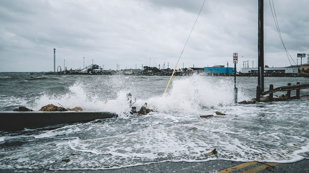 Water Crashing Over Bridge During Hurricane 