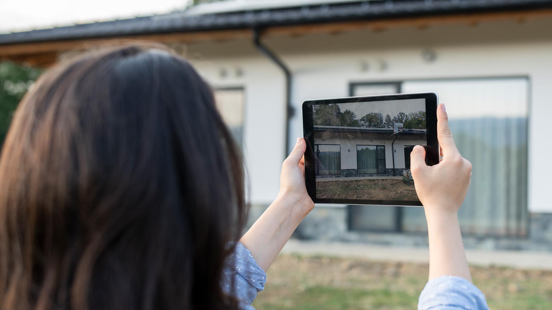 Adjuster Taking Photos On Tablet 