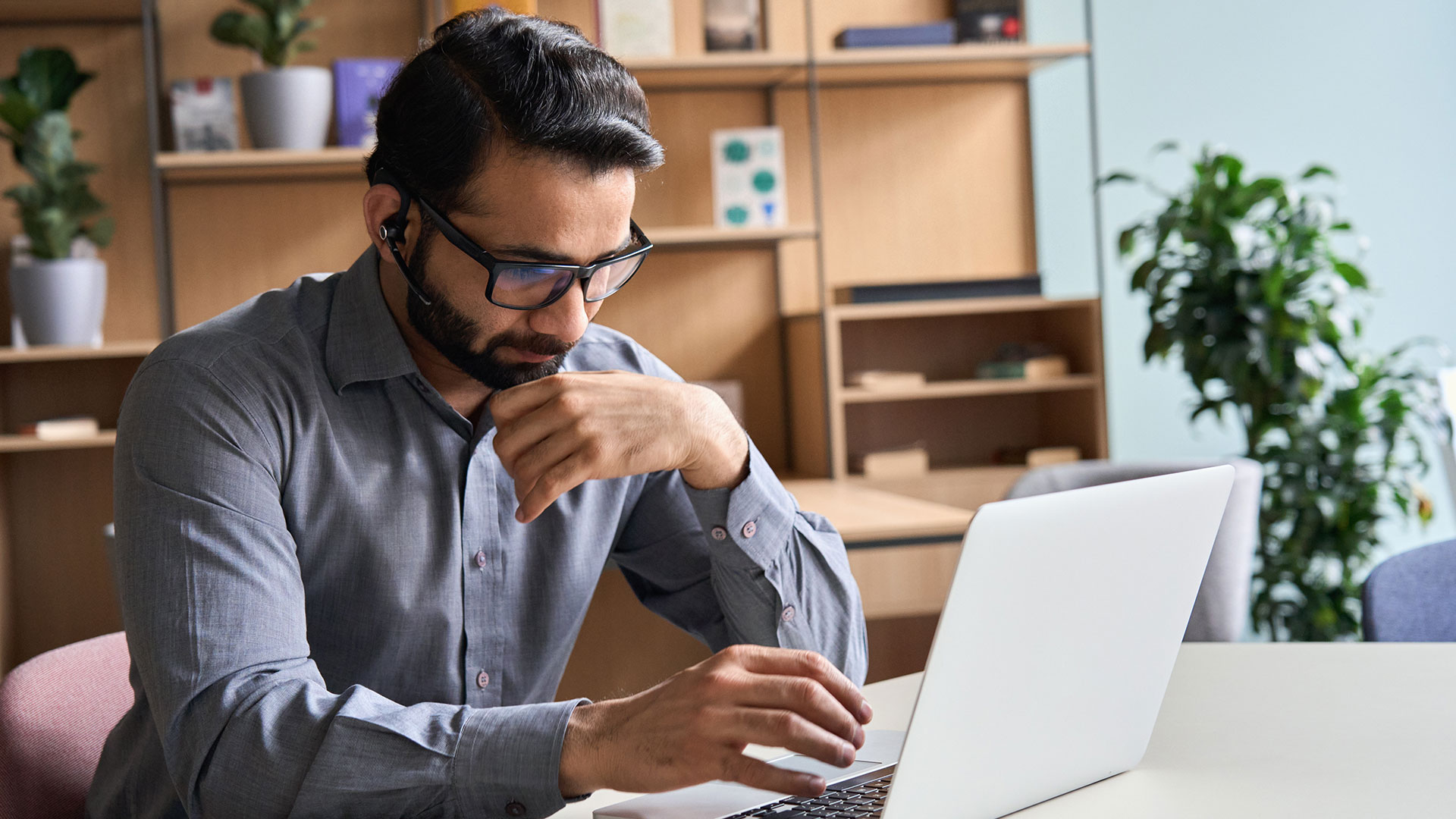 office-working-concentrating-on-laptop-screen
