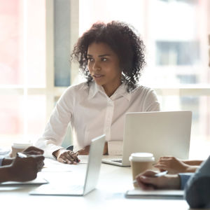 Colleagues Conversing Around Conference Table 